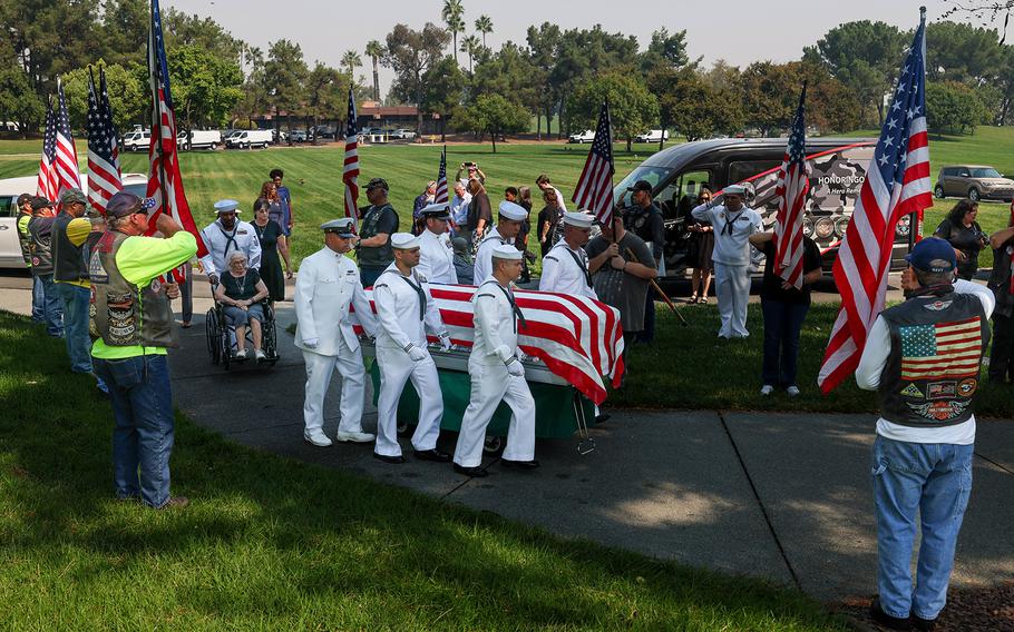 Sailors carrying the coffin of Everett Titterington to a burial site