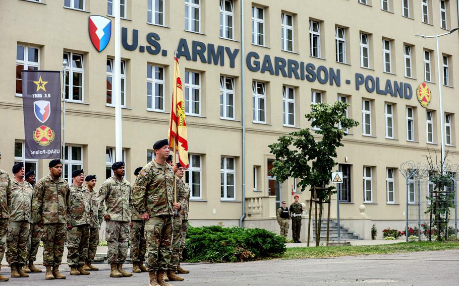 U.S. Army Col. Jesse Chace stands in front of his formation during the change of command ceremony at Camp Kosciuszko in Poznan, Poland, June 28, 2024. The Pentagon has approved accompanied, 24-month tours for service members assigned to the base in western Poland. The dependents must be 18 years and older to join service members there.