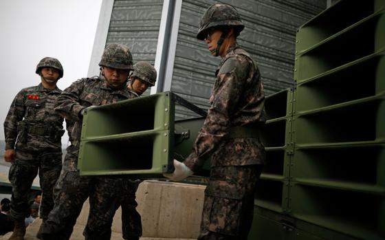 FILE - South Korean soldiers dismantle loudspeakers that set up for propaganda broadcasts near the demilitarized zone separating the two Koreas in Paju, South Korea, on May 1, 2018. South Korea announced Sunday, June 9, 2024 it would resume anti-North Korean propaganda loudspeaker broadcasts in border areas in retaliation to the North sending over 1,000 balloons filled with trash and manure over the last couple of weeks. (Kim Hong-Ji/Pool Photo via AP, File)