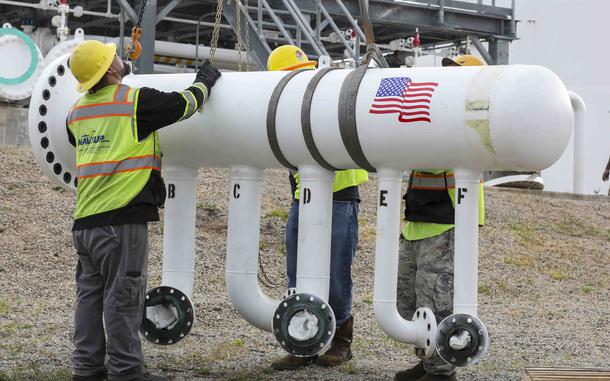 Contractors working for Navy Closure Task Force-Red Hill move a disassembled section of diesel fuel pipe outside of an entrance to the Red Hill Bulk Fuel Storage Facility, Hawaii, March 27, 2024.