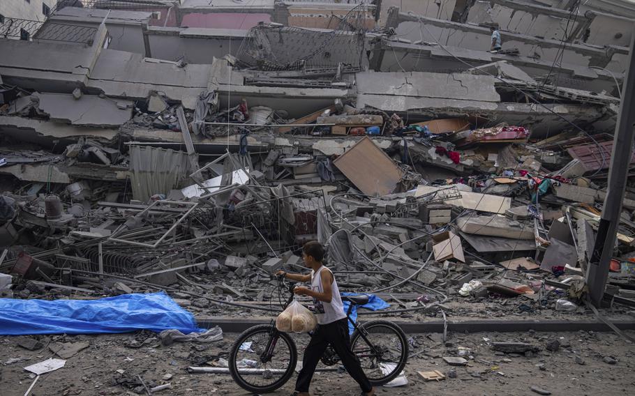 A building is reduced to rubble by an Israeli airstrike