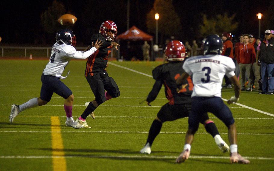 Rueben Todman throws the football.