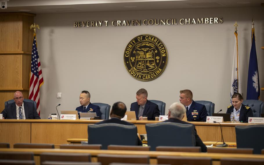 Members of the Coast Guard's Titan Submersible Marine Board of Investigation listen during the formal hearing inside the Charleston County Council Chambers, Monday, Sept. 23, 2024, in North Charleston, S.C.