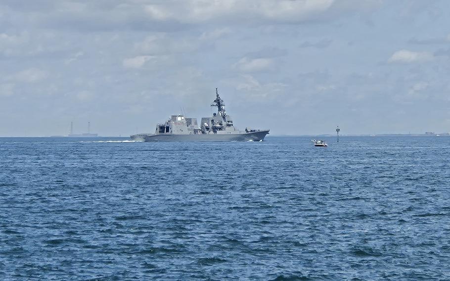 A U.S. Navy guided-missile destroyer departs Yokosuka Naval Base, Japan, Thursday, Aug. 15, 2024, ahead of Typhoon Ampil. 