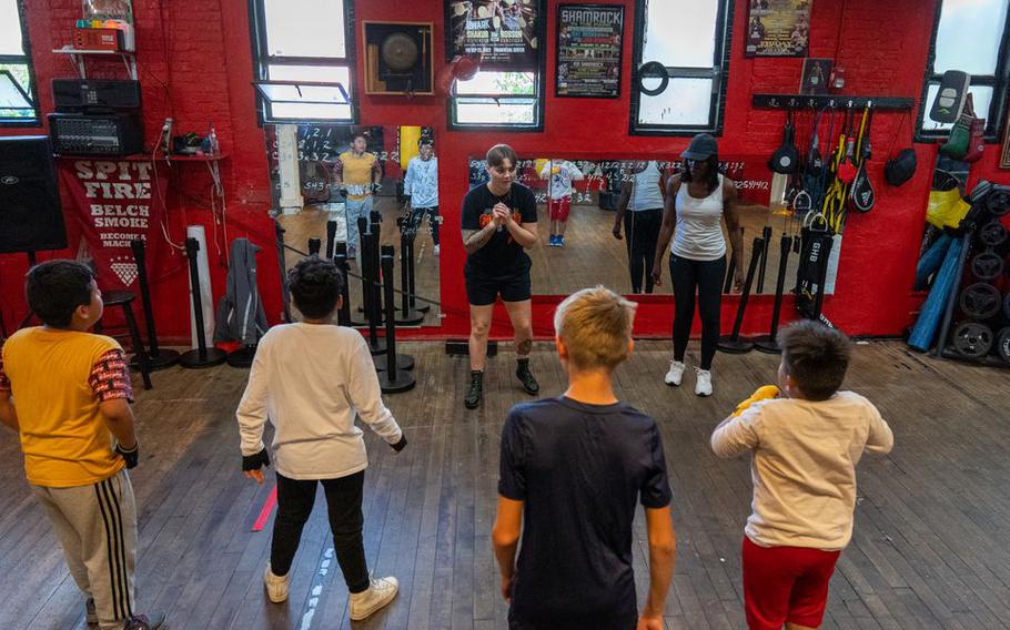 Maddison Van Der Mark, center, helps coach boxing along with Jackie Atkins, right, National Boxing Hall of Fame inductee, for New Jersey Give a Kid a Dream at Gleason’s Gym Jersey Shore in Long Branch, N.J., on May 8, 2023.