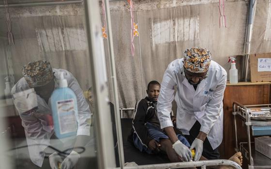 Medics treat a man wounded during fighting between Congolese government troops and M23 rebel forces in Goma's Kyeshero hospital Saturday, Feb. 1, 2025. (AP Photo/Moses Sawasawa)