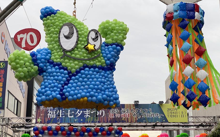 Fussa's mascot, Take, made of balloons, watches over the city's Tanabata Festival, July 8, 2024. 