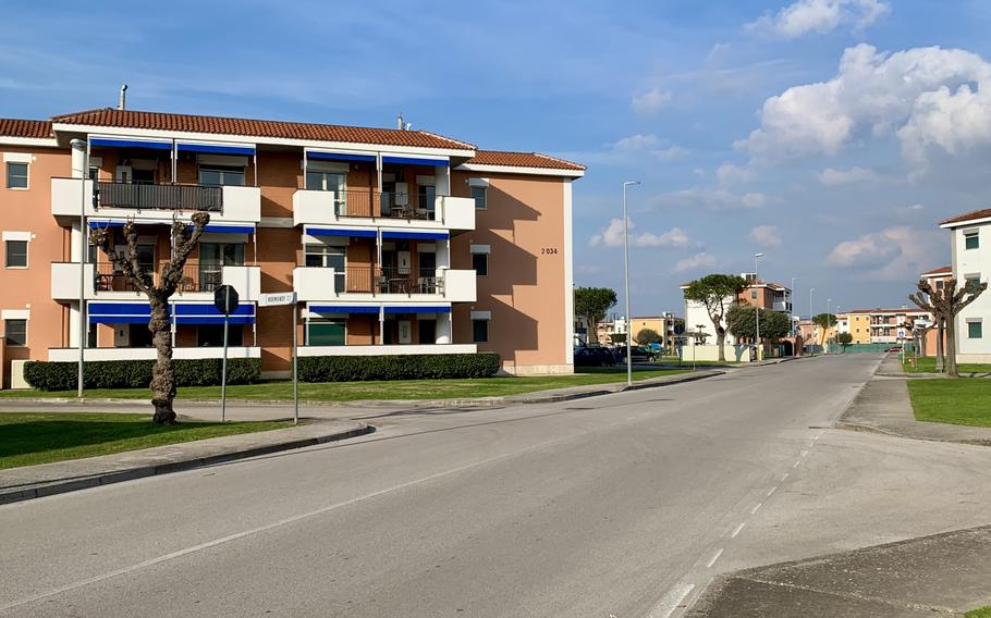 A Navy building alongside a road.