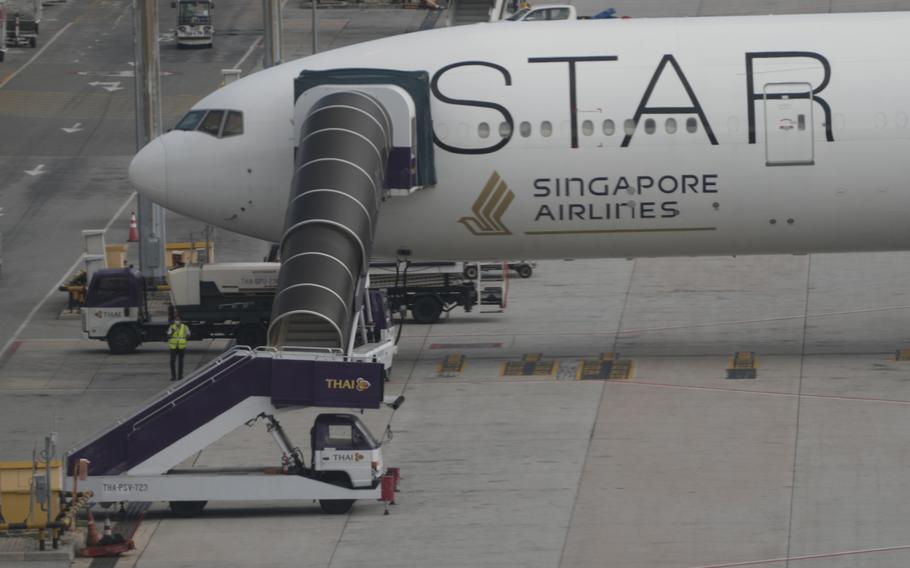The Boeing 777-300ER aircraft of Singapore Airlines, is parked after the SQ321 London-Singapore flight, that encountered severe turbulence, at Suvarnabhumi International Airport, near Bangkok, Thailand, Wednesday, May 22, 2024. The Singapore Airlines flight descended 6,000 feet (around 1,800 meters) in about three minutes, the carrier said Tuesday. A British man died and authorities said dozens of passengers were injured, some severely. 
