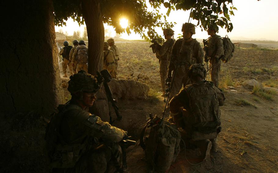 Soldiers with Company C, 1st Battalion, 32 Infantry Regiment, 3rd Brigade Combat Team, 10th Mountain Division pause before pushing into another compound during Operation Steel Lion III.