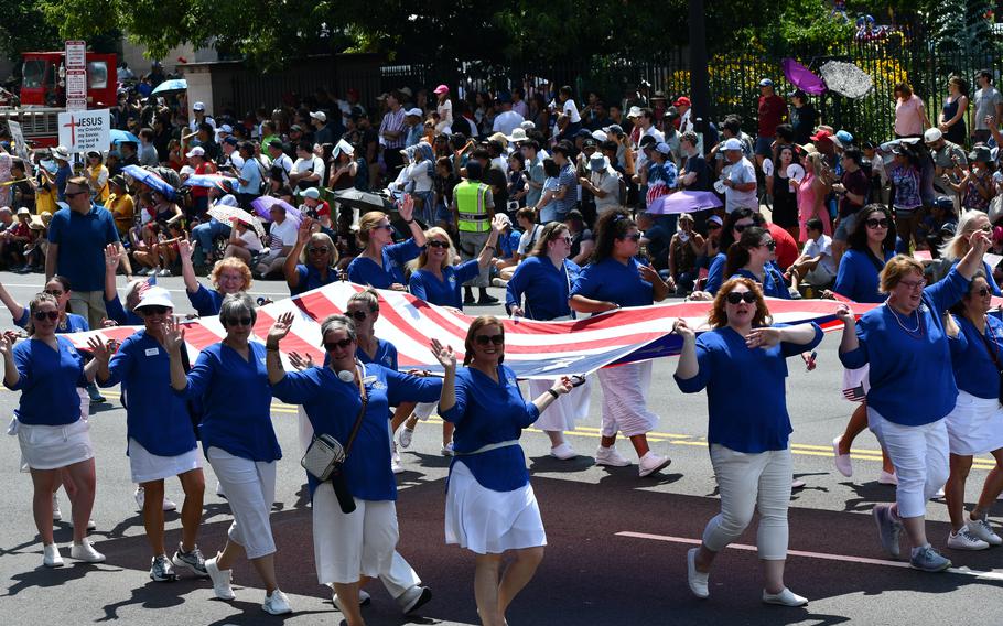 The Daughters of the American Revolution carry a large American flag in Washington, D.C.’s Independence Day parade on July 4, 2024.