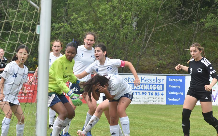 Black Forest Academy players react with horror as they watch a header from Vicenza's Maya Fitch elude them and slowly bounce into the goal Wednesday, May 22, 2024, at the DODEA European Division II girls soccer championships at Reichenbach-Steegen, Germany.