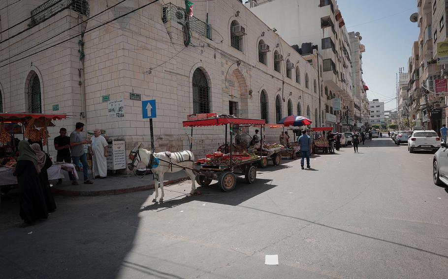 Fruit and vegetable sellers line up donkey carts last month in the Al-Rimal neighborhood of Gaza City. 