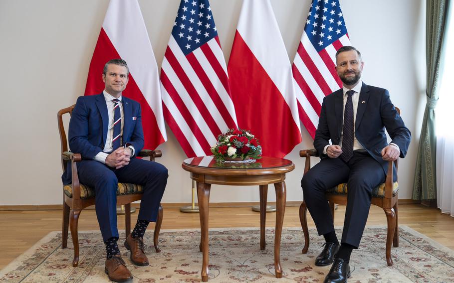 U.S. Secretary of Defense Pete Hegseth sits with Polish Deputy Prime Minister Wladyslaw Kosiniak-Kamysz