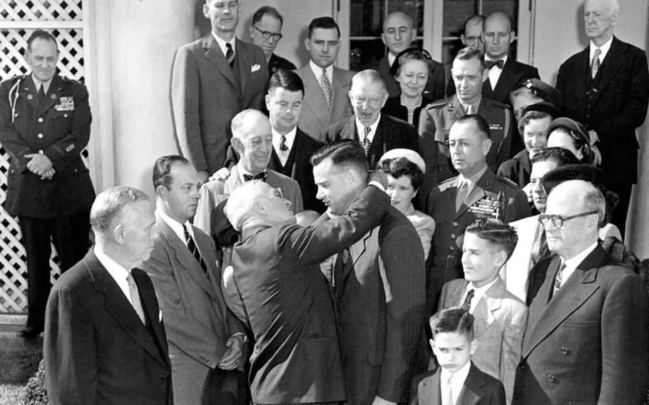 President Harry S. Truman presents the Medal of Honor to Marine Corps veteran Justice Chambers.