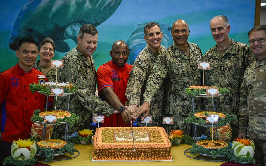 Rear Adm. Carlos Sardiello, commander, U.S. Naval Forces Southern Command/U.S. 4th Fleet, serves Thanksgiving Day meals to service members