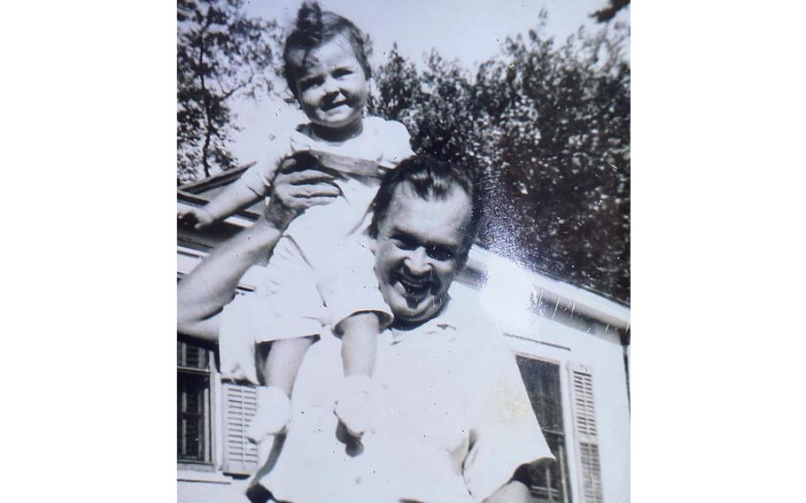 Marilyn Newman on the shoulder of her father Ralph Newman in an undated photo. Ralph Newman drew comics and cartoons for the London edition of Stars and Stripes during World War II and later became a cartoonist for major animation studios. On July 26, 2024, he will be awarded the Bill Finger Award for Excellence in Comic Book Writing at Comic-Con International in San Diego.