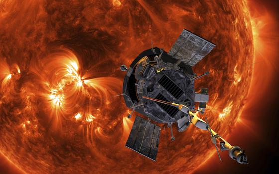 FILE - This image made available by NASA shows an artist's rendering of the Parker Solar Probe approaching the Sun. It's designed to take solar punishment like never before, thanks to its revolutionary heat shield that's capable of withstanding 2,500 degrees Fahrenheit (1,370 degrees Celsius). (Steve Gribben/Johns Hopkins APL/NASA via AP, File)