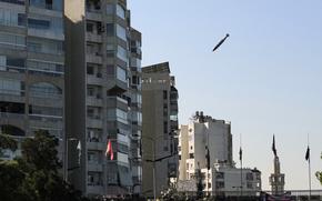 An Israeli bomb is seen falling through the air, aiming at a building in Beirut, Lebanon Nov. 15, 2024.