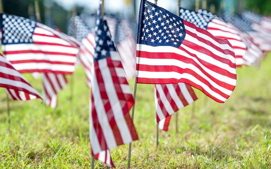 American flags wave outside the 177th Fighter Wing in Egg Harbor Township, N.J., in honor of veterans who died by suicide. Service members are particularly vulnerable while transitioning to civilian life, with suicide rates about 2.5 times higher among veterans in their first year of separation than among active duty troops, according to a Government Accountability Office report released July 15, 2024. 