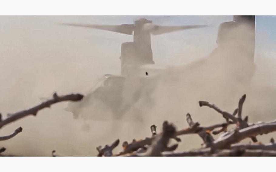 A video screen grab shows an MV-22 Osprey lifting off as it stirs up a cloud of dust. The body of Staff Sgt. Jacob Galliher, of Pittsfield, Mass., was recovered off the coast of Japan on Friday, after a CV-22 Osprey crashed on Wednesday.
