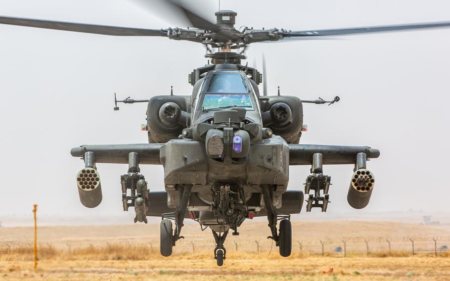 An AH-64D Apache Longbow attack helicopter takes off for a mission in Iraq.