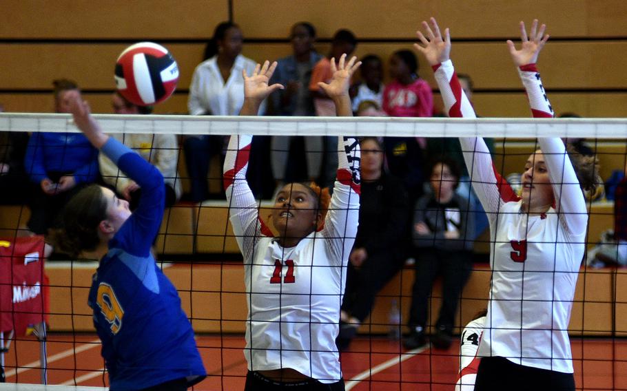 Kaiserslautern's Briana Shields, center, and Rozlynn Onnen go to block an attack by Wiesbaden's Bridget Pidgeon during a match on Sept. 21, 2024, at Kaiserslautern High School in Kaiserslautern, Germany.