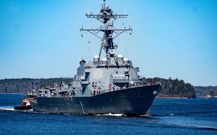 The future USS John Basilone transits the Kennebec River near Bath, Maine, heading out to sea to conduct trials in April 2024. 