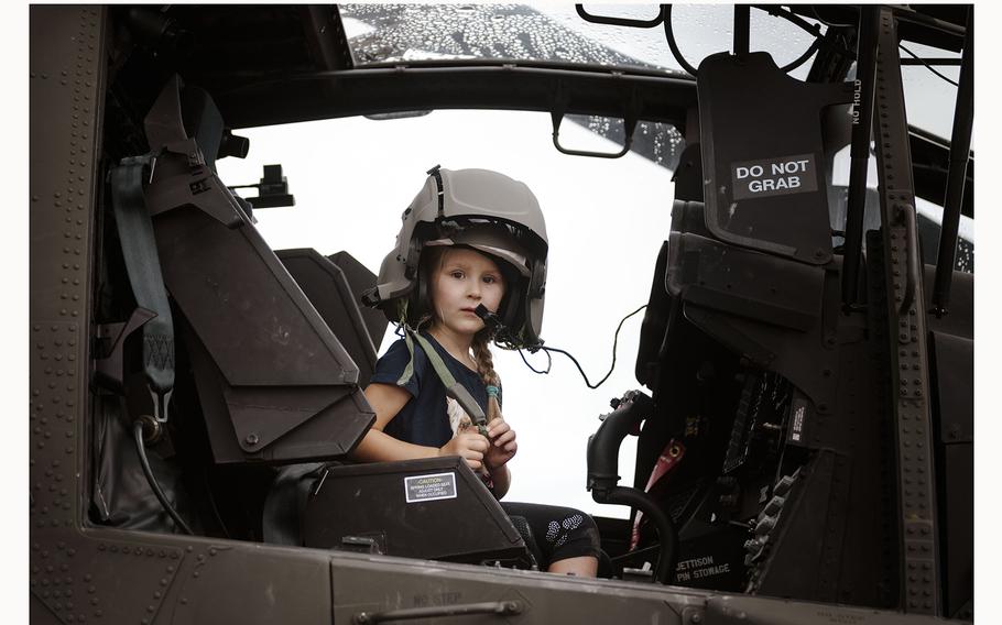 A local family takes a tour of a military vehicle at the 63rd Annual German-American Volksfest on Camp Algiers, Grafenwoehr, Germany from August 2-4, 2024. 