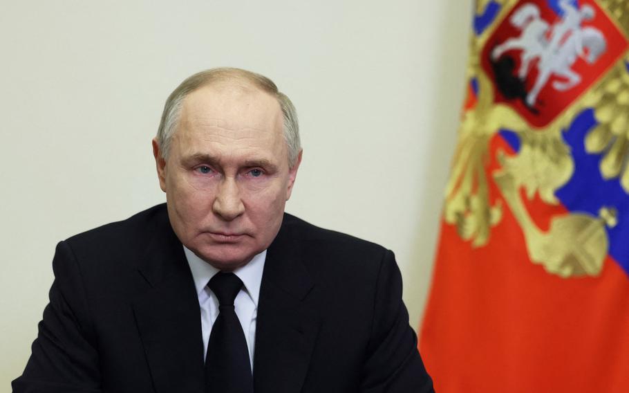 Russia’s President Vladimir Putin delivers his address in Moscow 