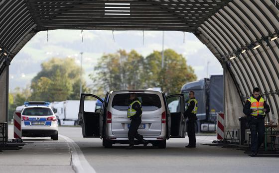 FILE - German federal police officers check a van at the Austrian-German border crossing point in Kiefersfelden, Germany, Oct. 9, 2023. (AP Photo/Matthias Schrader, File)