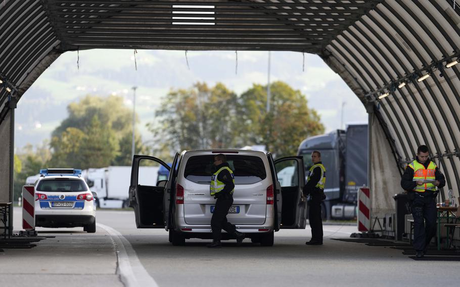 German federal police officers check a van