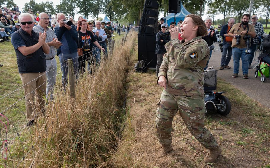 Sgt. 1st Class Christine Permenter, a vocalist with the 101st Airborne Division, performs at a ceremony