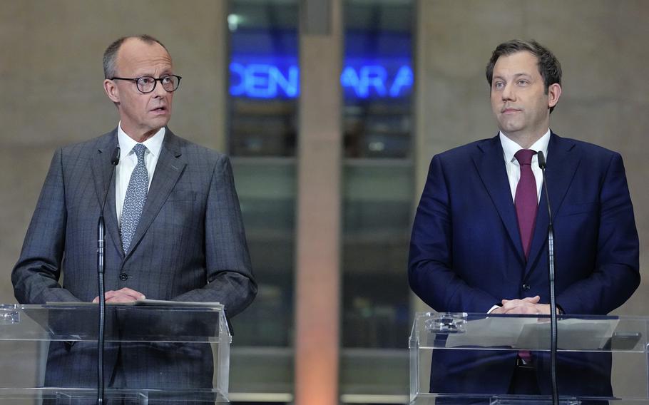 Friedrich Merz, left, leader of the Christian Democratic Union (CDU) and Lars Klingbeil, co-leader of the Social Democratic Party (SPD) address the media during a press conference in Berlin, Germany, Tuesday, March 4, 2025. 