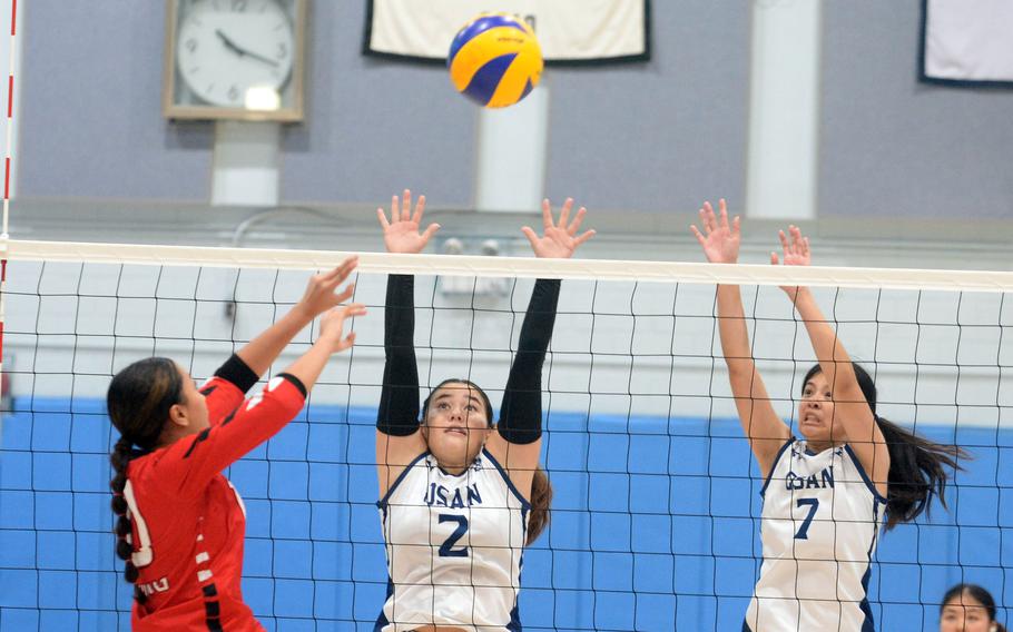 E.J. King and Osan play girls volleyball.