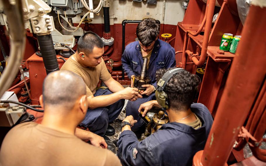 Sailors make repairs aboard the destroyer USS Halsey. A government watchdog agency report found that the Navy’s fleet is hamstrung by a shortage of manpower and training on ship maintenance and repair.