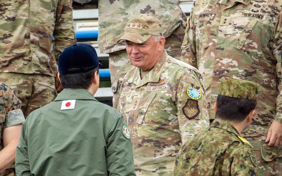 Air Force Lt. Gen. Ricky Rupp, commander of U.S. Forces Japan, speaks with Japanese Defense Minister Minoru Kihara during a live-fire exercise near Mount Fuji, May 27, 2024.