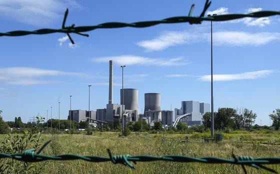 FILE - The shut down coal-fired power plant Westfalen of RWE Generation SE is seen behind a fence in Hamm, Germany, Thursday, Aug. 10, 2023. (AP Photo/Martin Meissner, File)