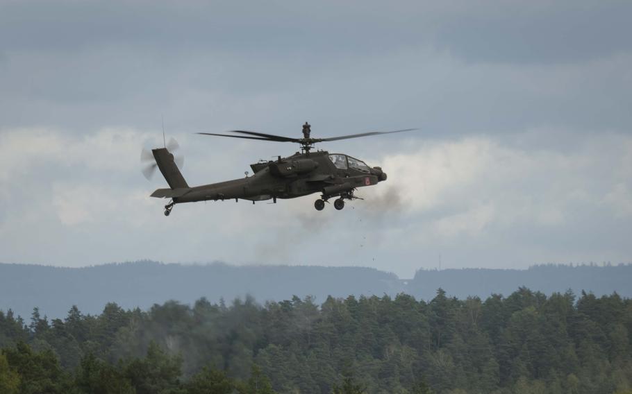 An Apache helicopter fires live ammunition at static ground targets at Grafenwoehr Training Area in Germany on Sept. 24, 2024.