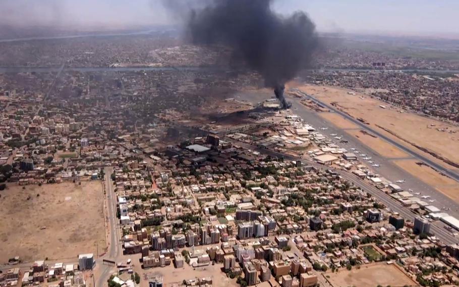 A screen grab taken from video footage of smoke rising above Khartoum International Airport, on April 20, 2023.