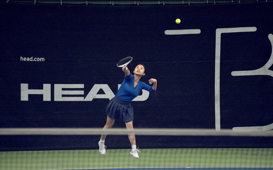 Ansbach's Meredith Maxwell serves during pool-play action against Ramstein's Emma Singletary during the DODEA European tennis championships on Oct. 20, 2023, at T2 Sports Health Club in Wiesbaden, Germany.