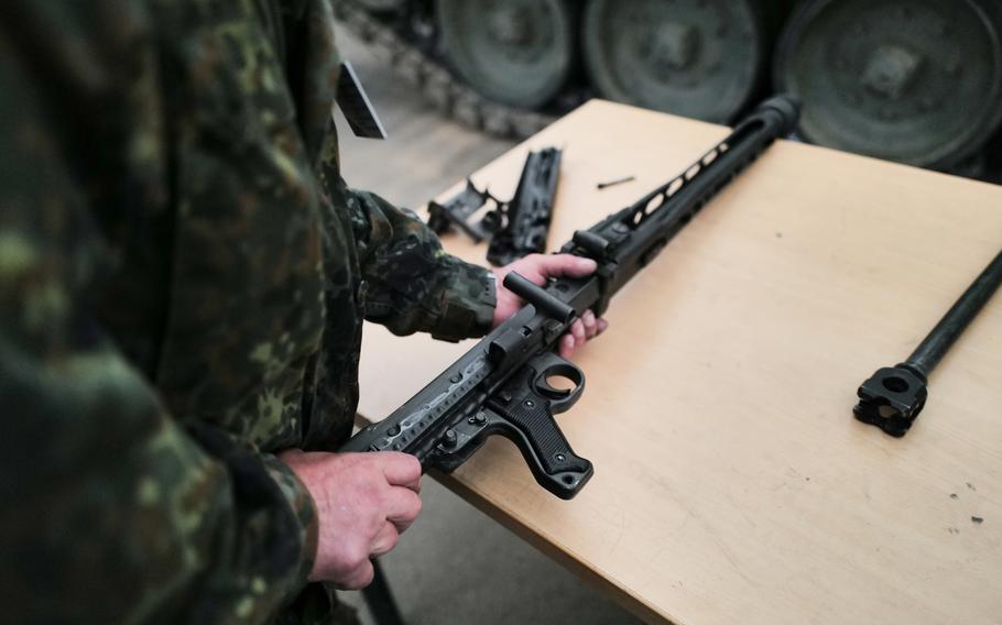 A Ukrainian soldier disassembles an MG3 machine gun during a training session at the Klietz military training range, Germany, on June 13, 2024. The German machine gun is the standard secondary weapon system on the Leopard 1 A5 tank.