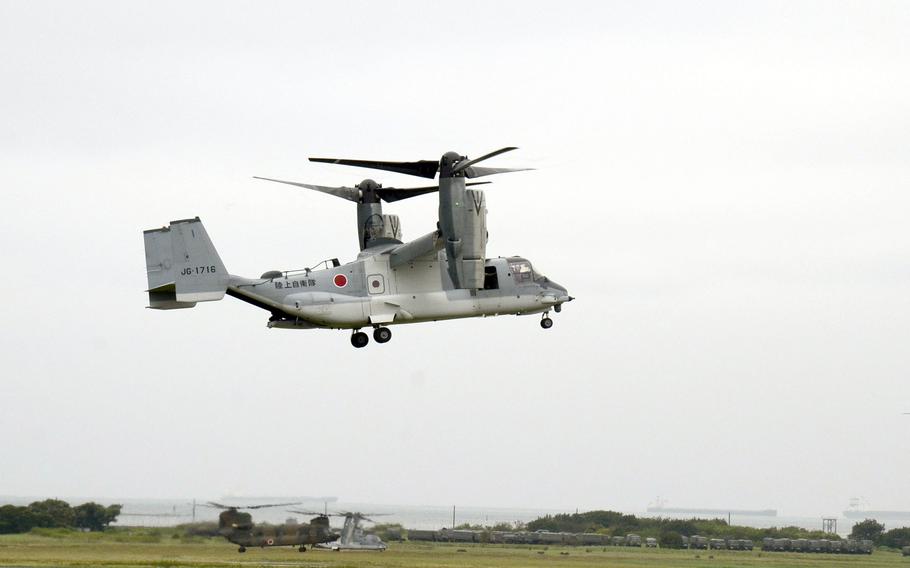 An Osprey flies above the ground at Camp Kisarazu.