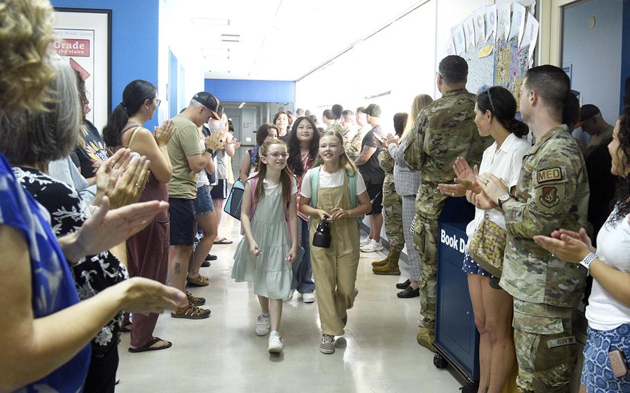 Parents, teachers and staff welcome students back to Yokota Middle School at Yokota Air Base, Japan, Monday, Aug. 19, 2024.