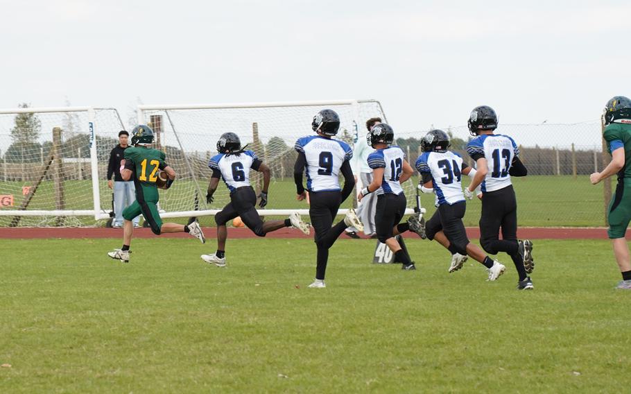 Grant Cumming runs with the football.