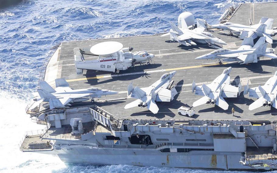 Jets are parked on the flight deck of the damaged aircraft carrier USS Harry S. Truman as it transits in the Mediterranean Sea.