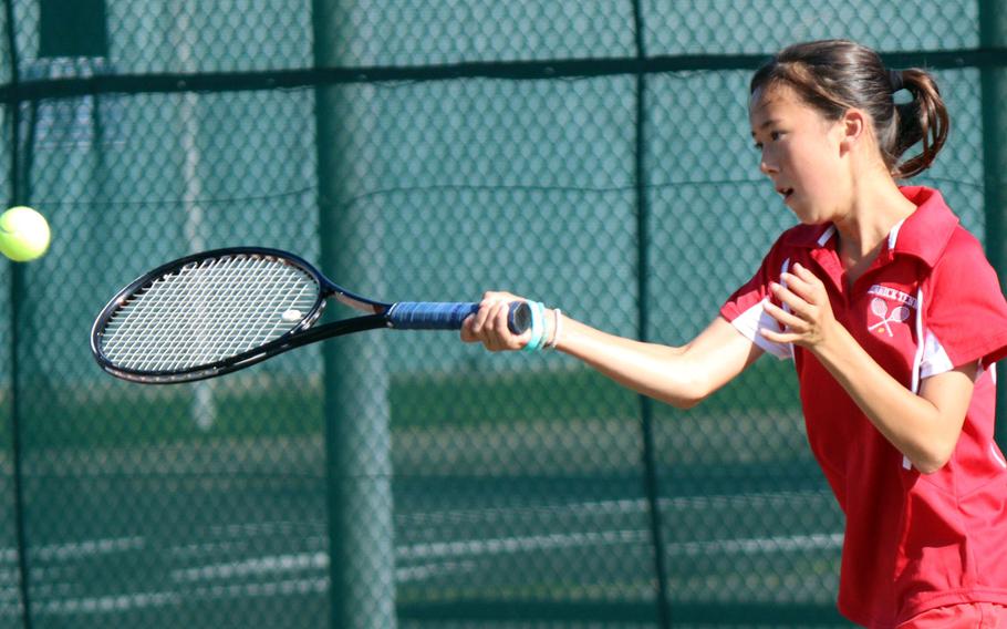 Nile C. Kinnick's Lisa Galloway pops a returnl during Tuesday's Kanto Plain tennis matches. Galloway and doubles partner Kikyo Deeter lost to American School In Japan's Yume Rivon-Matsushita and Koko Watanabe  8-4.