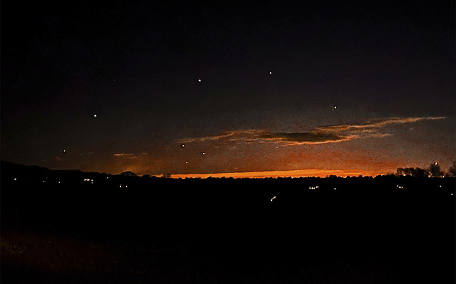 This photo provided by Trisha Bushey shows the evening sky and points of light near in Lebanon Township, N.J.