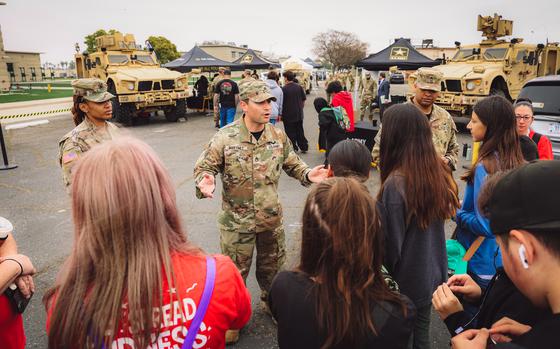 Army Staff Sgt. Brandon Martinez with the Fontana Army Recruiting Company welcomes students at a “Meet Your Army” event at Joint Forces Training Base Los Alamitos, Calif., on April 22, 2024. 