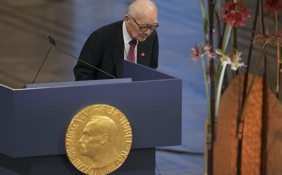 Terumi Tanaka, a representative of this year's Nobel Peace Prize winner Nihon Hidankyo, or the Japan Confederation of A- and H-Bomb Sufferers Organizations, bows after speaking during the Nobel Peace Prize ceremony at the City Hall in Oslo, Norway, Tuesday, Dec. 10, 2024. (AP Photo/Kin Cheung)